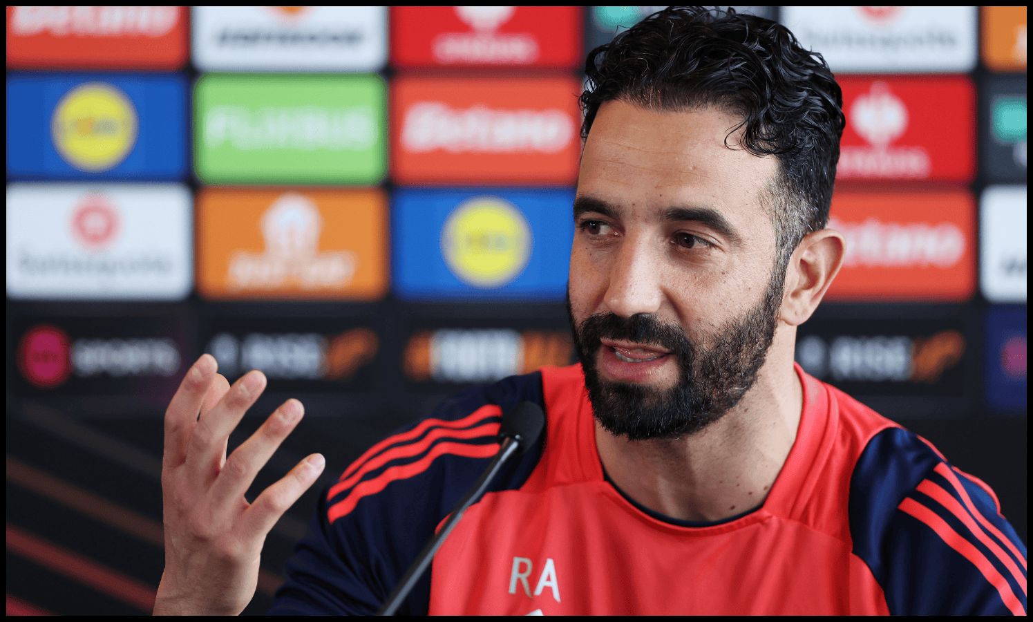 Ruben Amorim gestures while speaking in a Man United press conference.