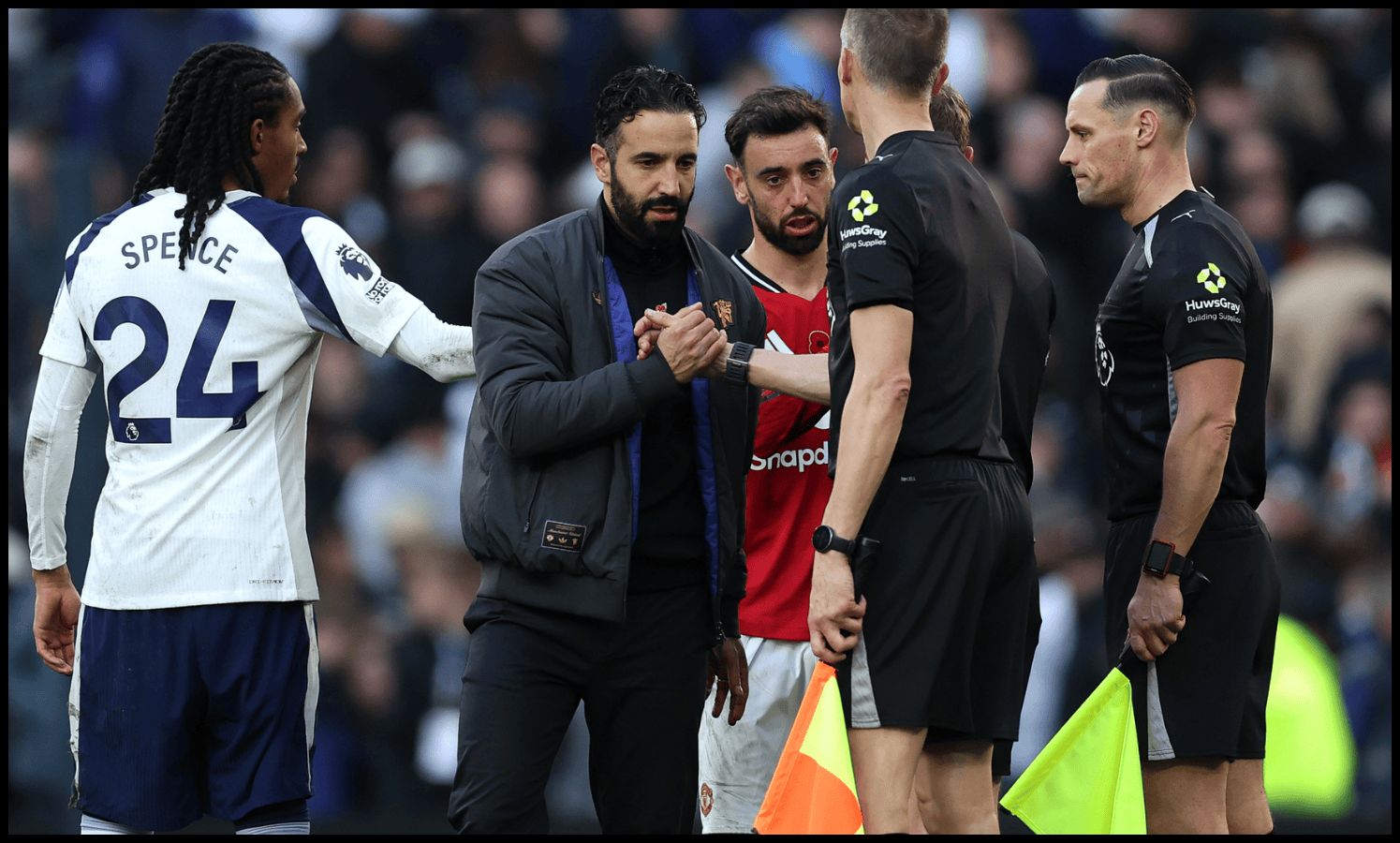 Ruben Amorim shakes hands with the match officials at full-time vs Tottenham.