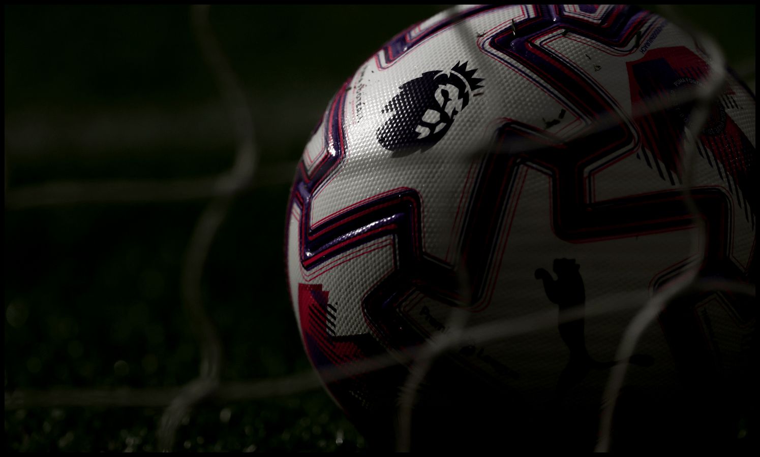 A Premier League ball in the net at Old Trafford.