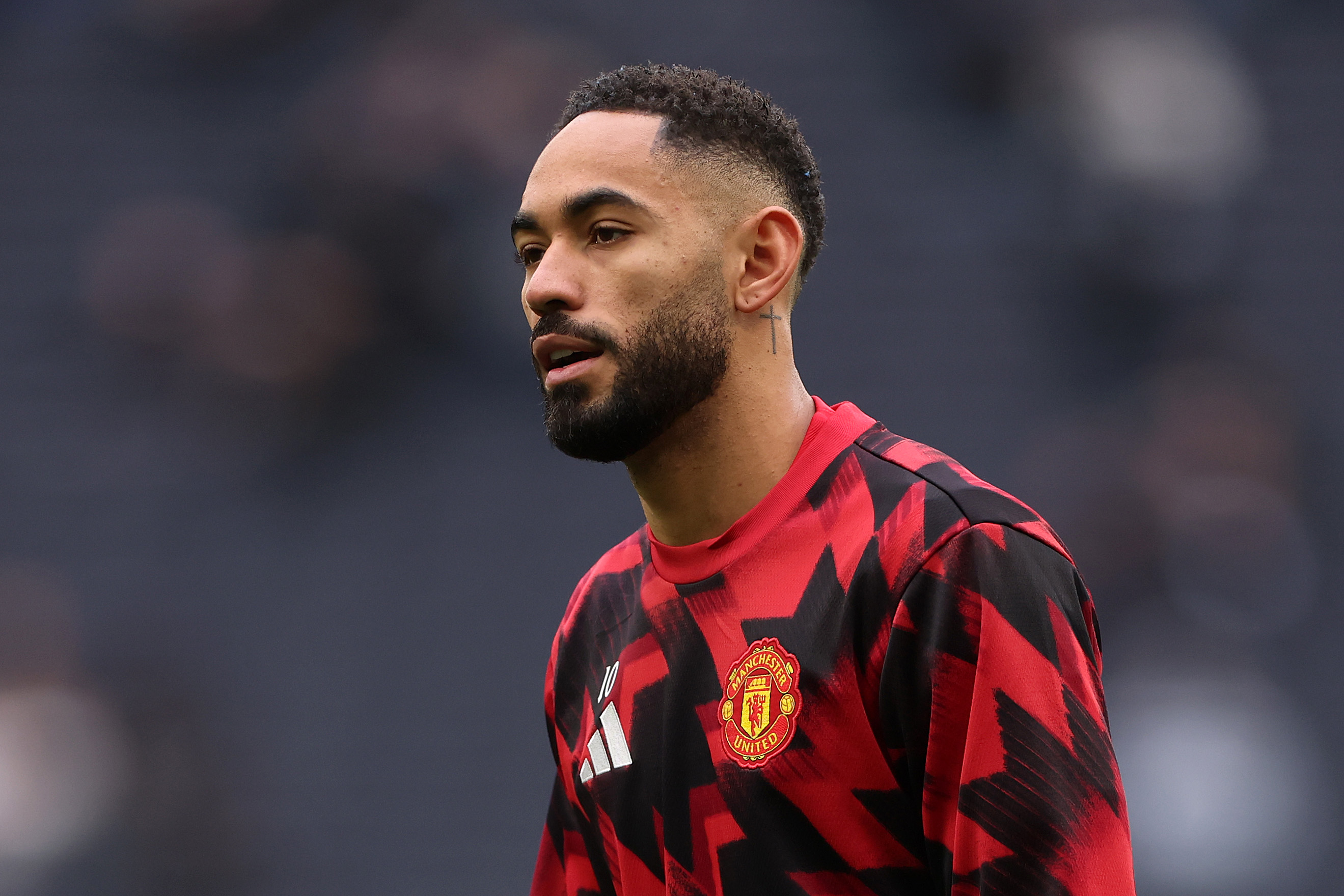 Matheus Cunha warms up before kick-off.