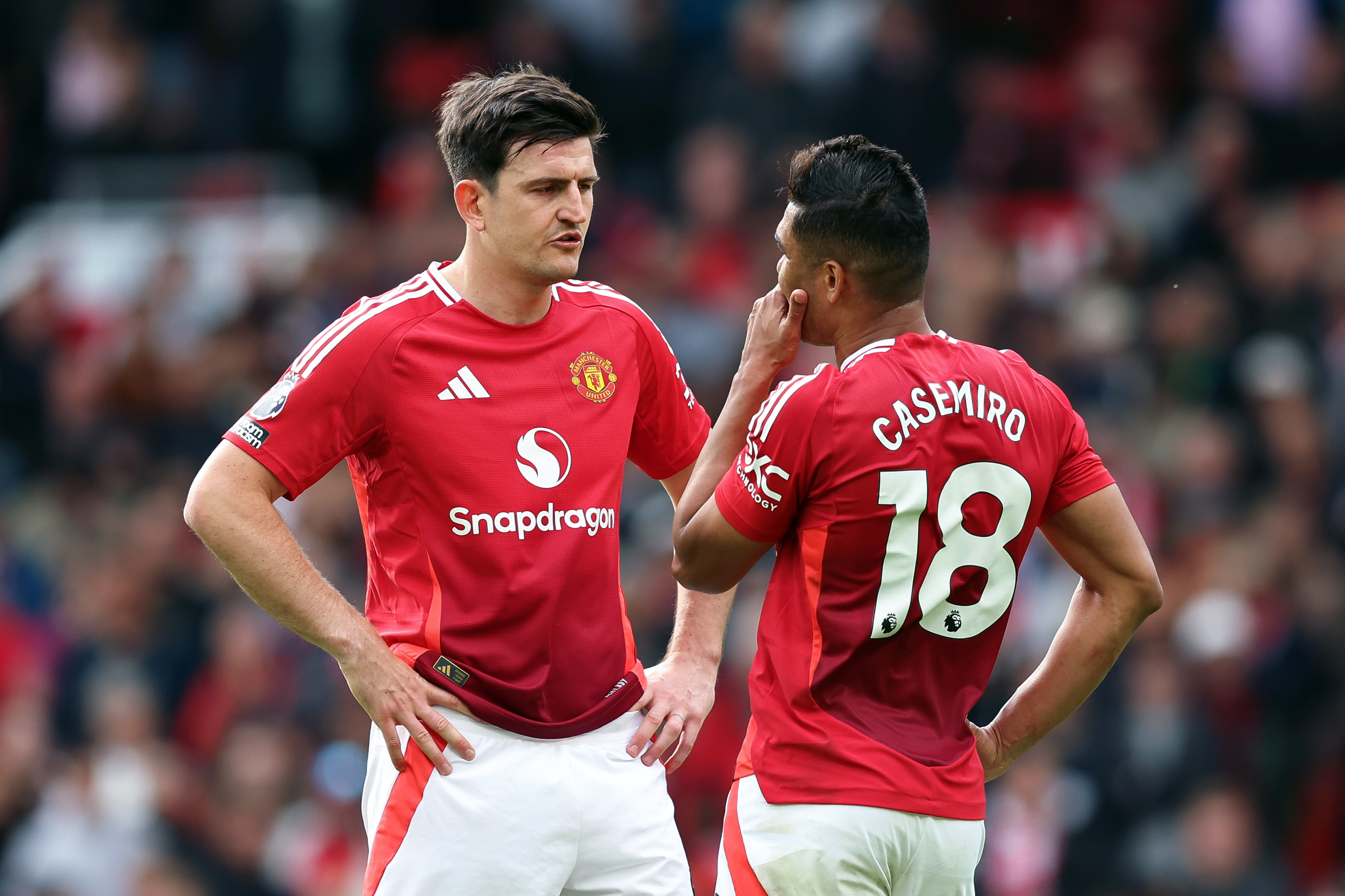 Harry Maguire and Casemiro in discussion at Old Trafford.
