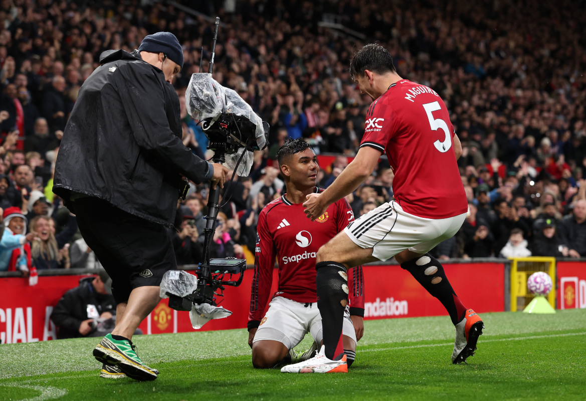 Harry Maguire celebrates with Casemiro after the midfielder’s goal.