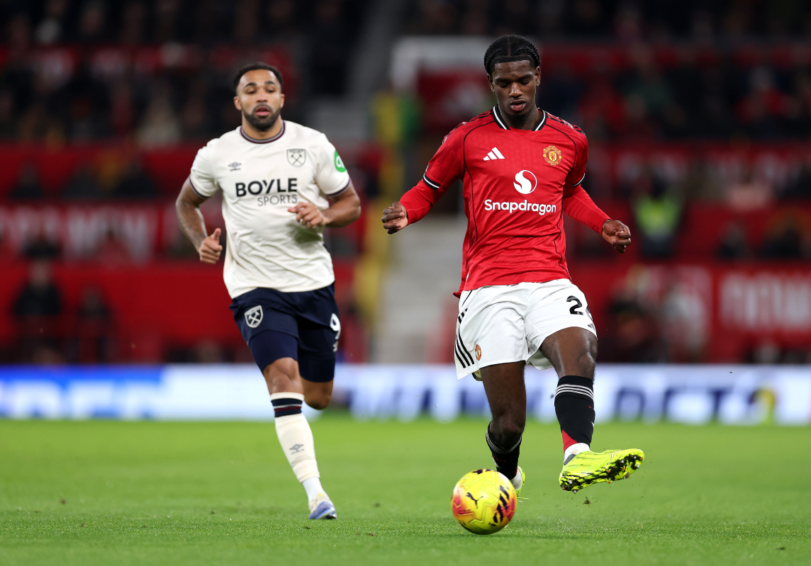 Ayden Heaven plays the ball while in action for Man United at Old Trafford.