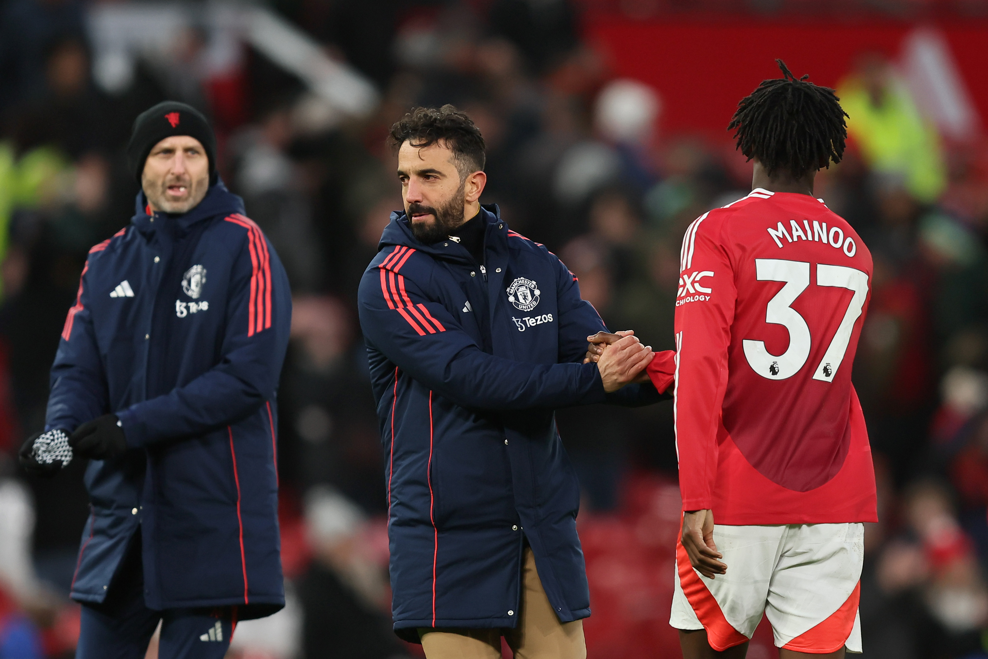 Ruben Amorim shakes hands with Kobbie Mainoo at full-time.