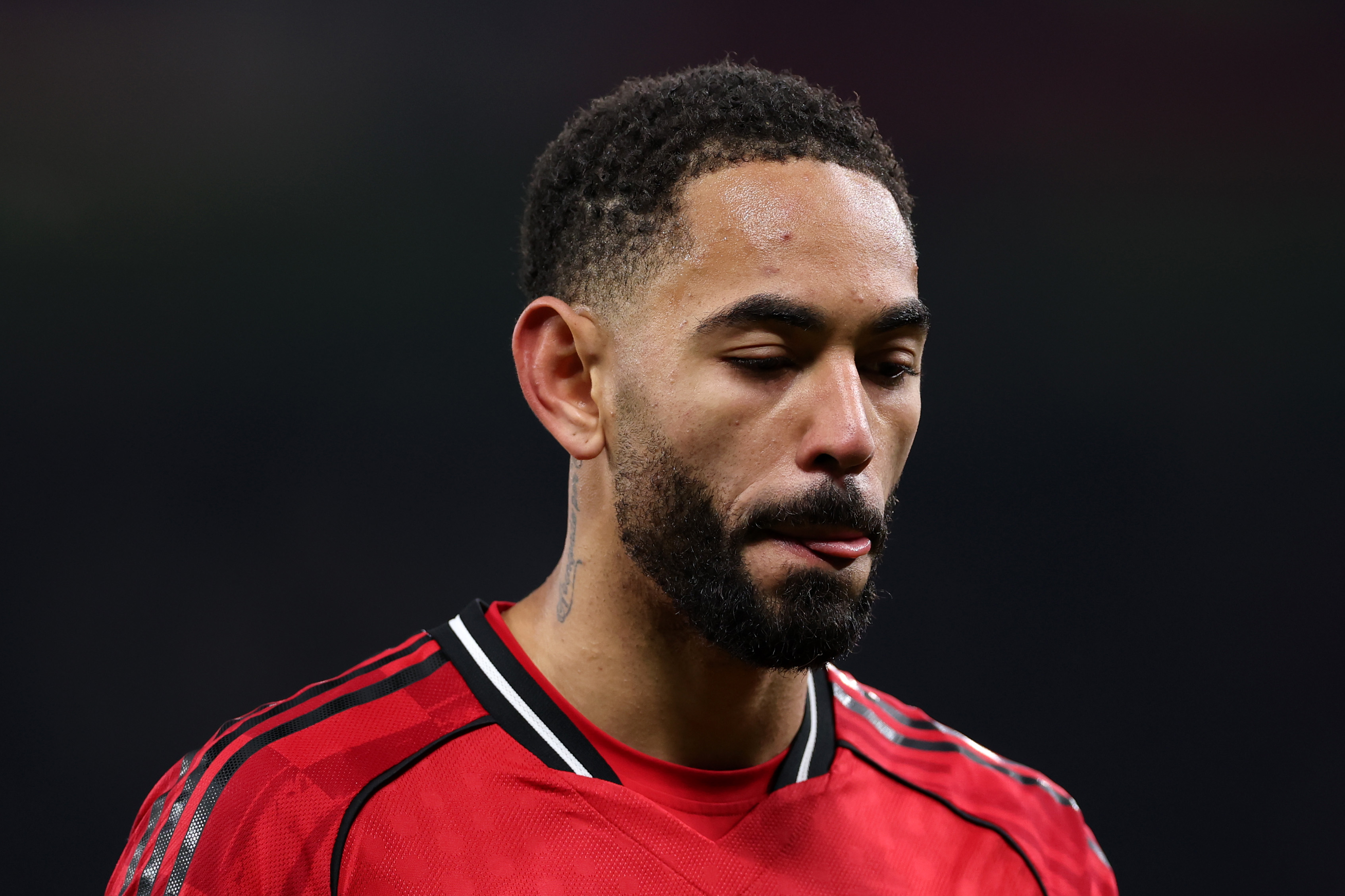 Matheus Cunha looks down while in action for Man United against West Ham.
