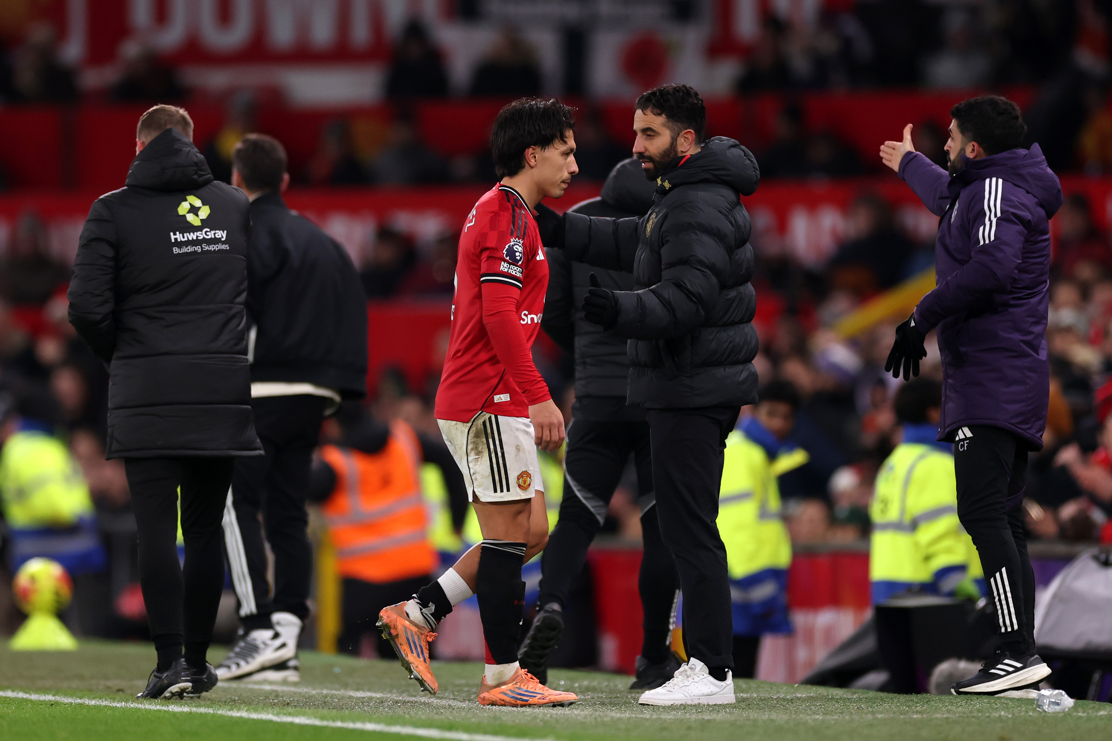 Ruben Amorim acknowledges Lisandro Martinez as he exits the pitch at Old Trafford.