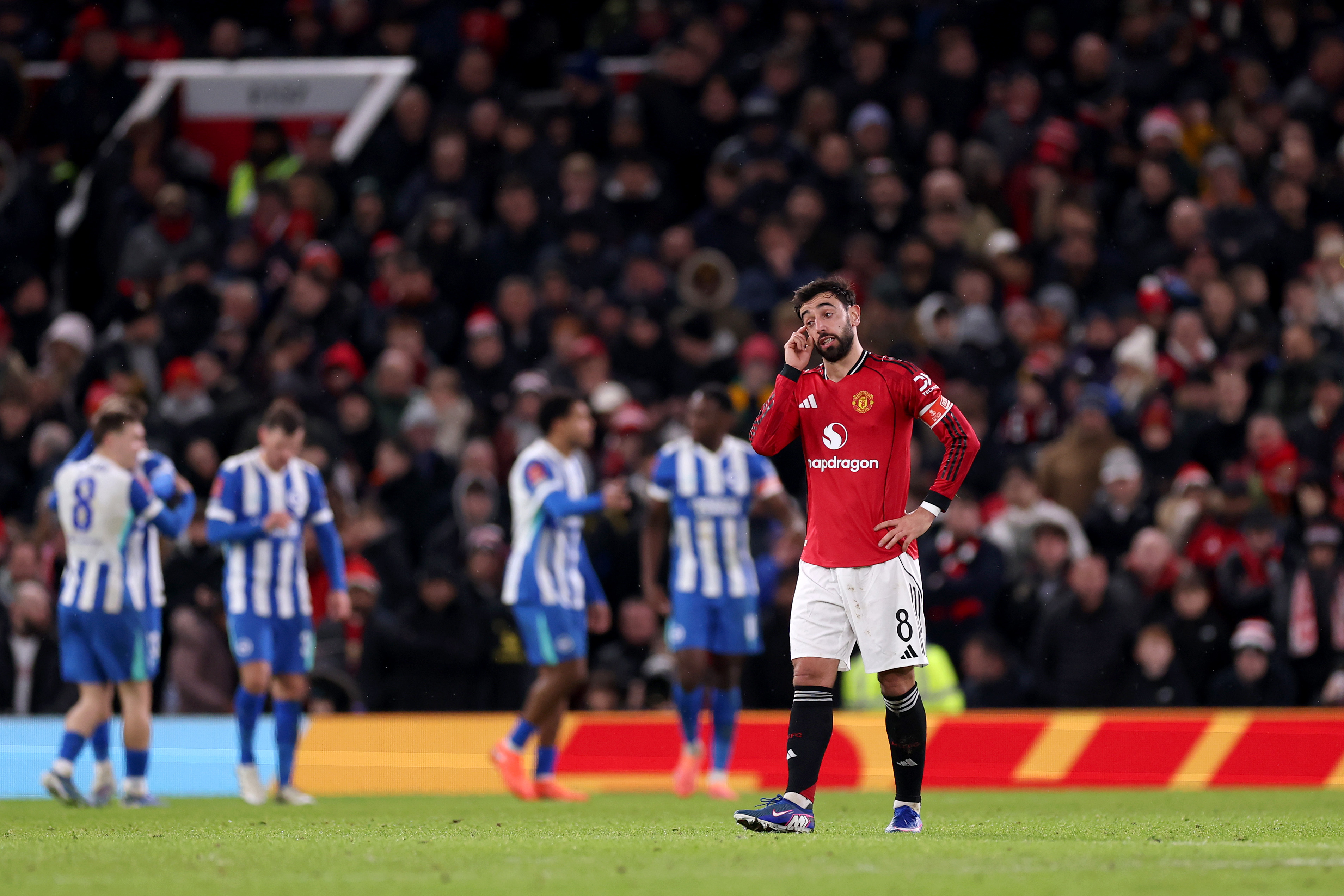 Bruno Fernandes gestures to his teammates after Brighton score.