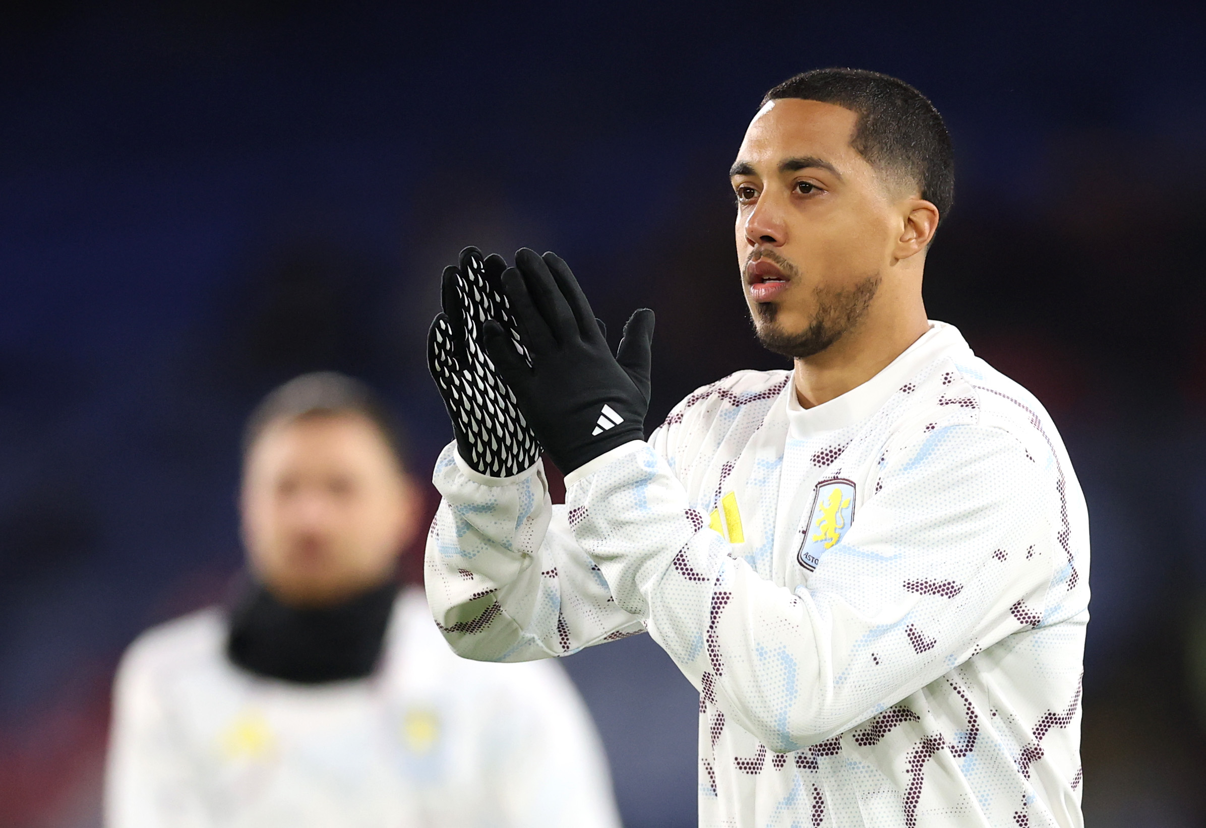 Youri Tielemans applauds the Aston Villa fans while warming up before kick-off. 