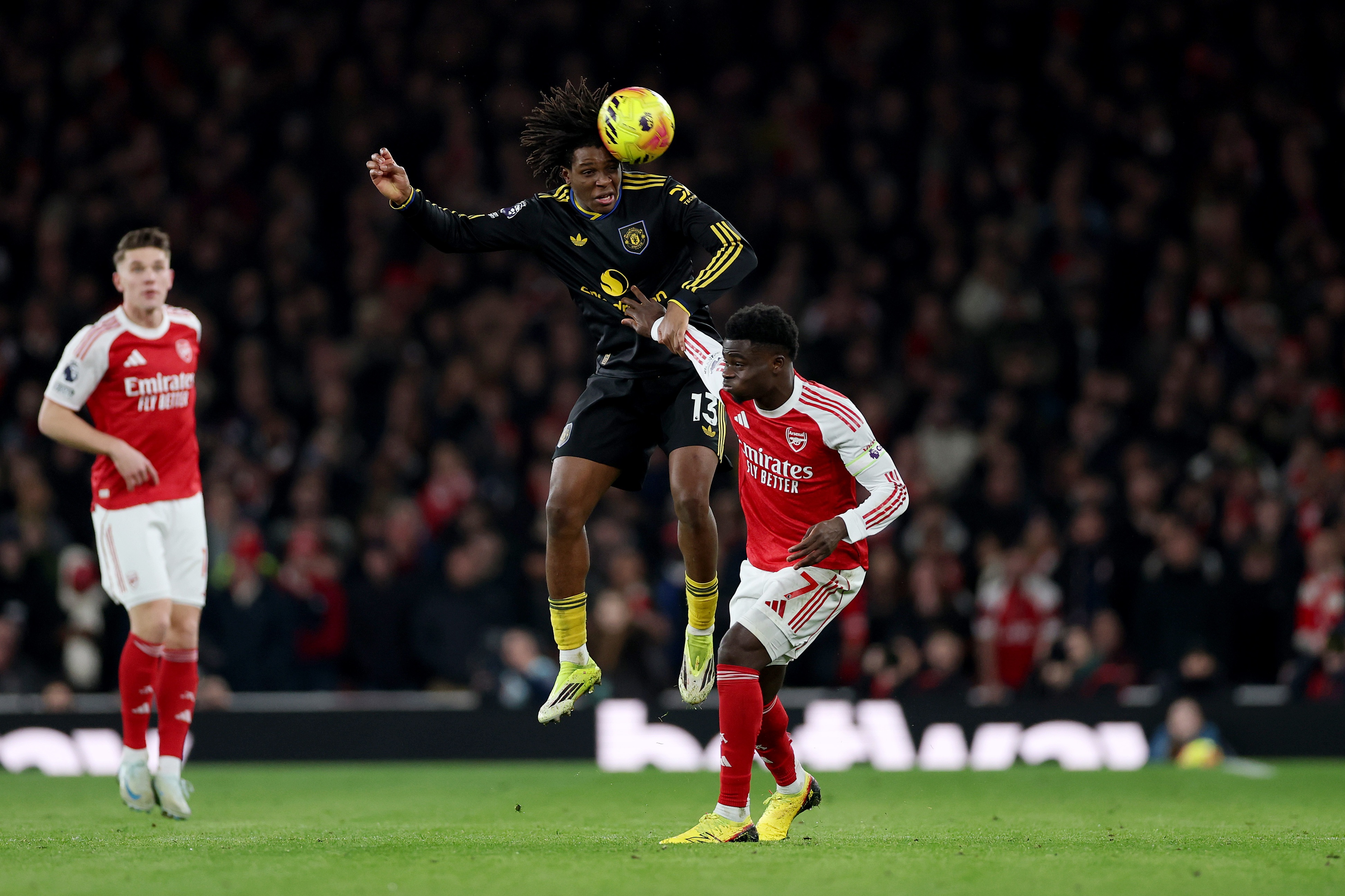 Patrick Dorgu heads the football during Manchester United game.