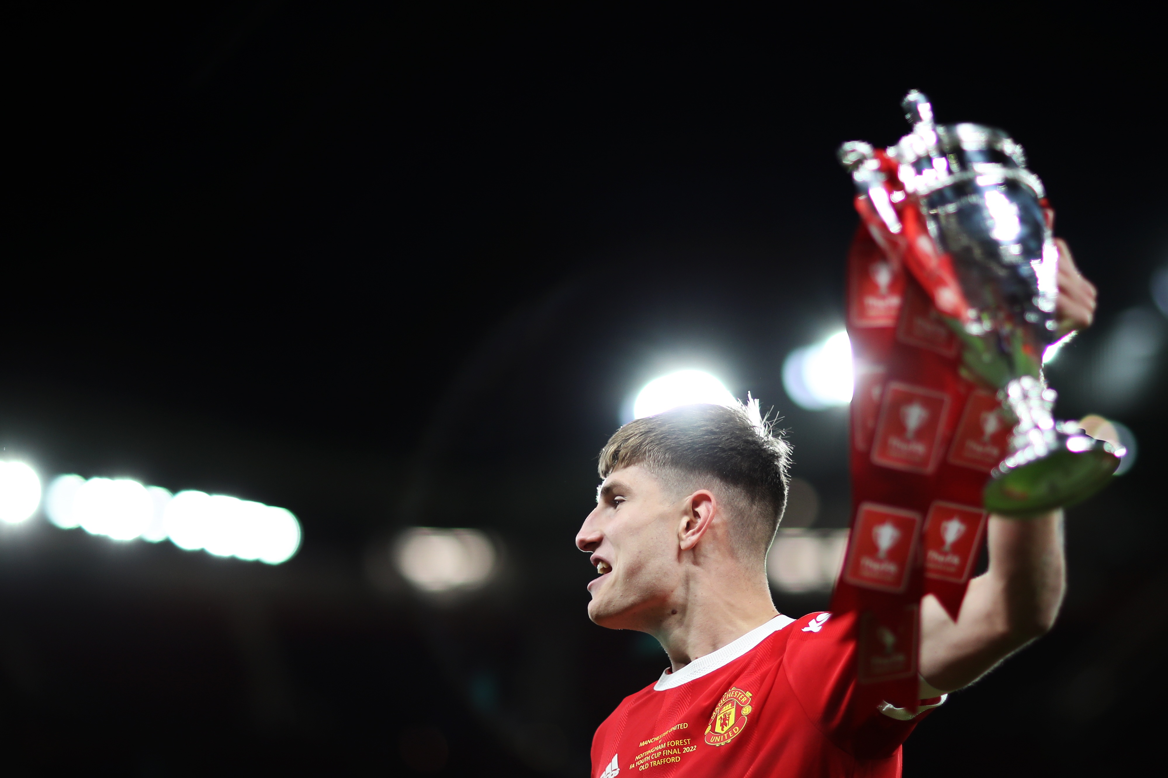 Rhys Bennett lifts up the FA Youth Cup trophy.