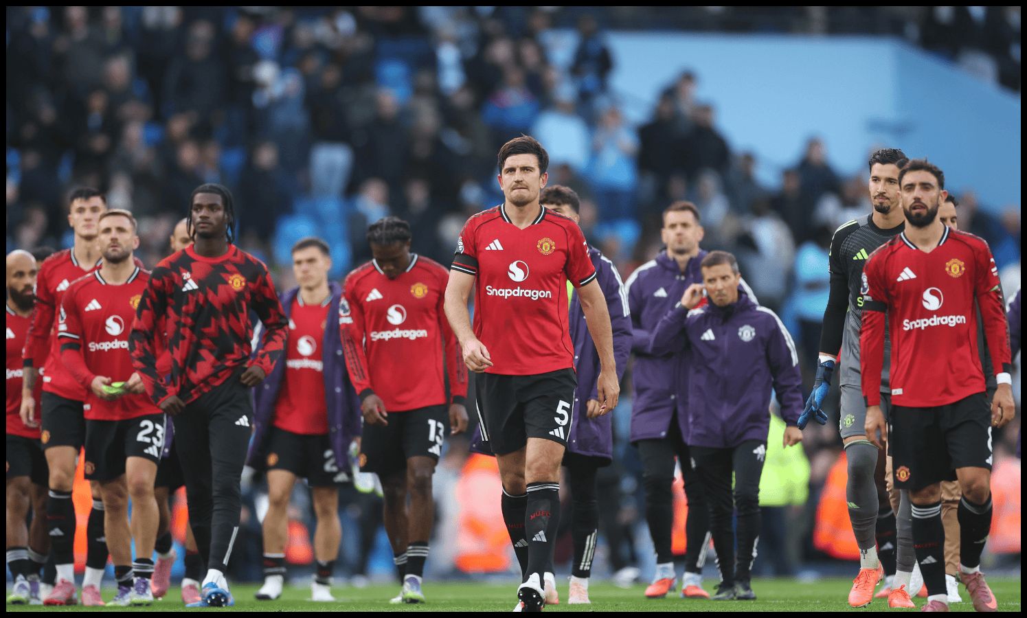 Harry Maguire and his Man United teammaets look dejected after losing to Man City.