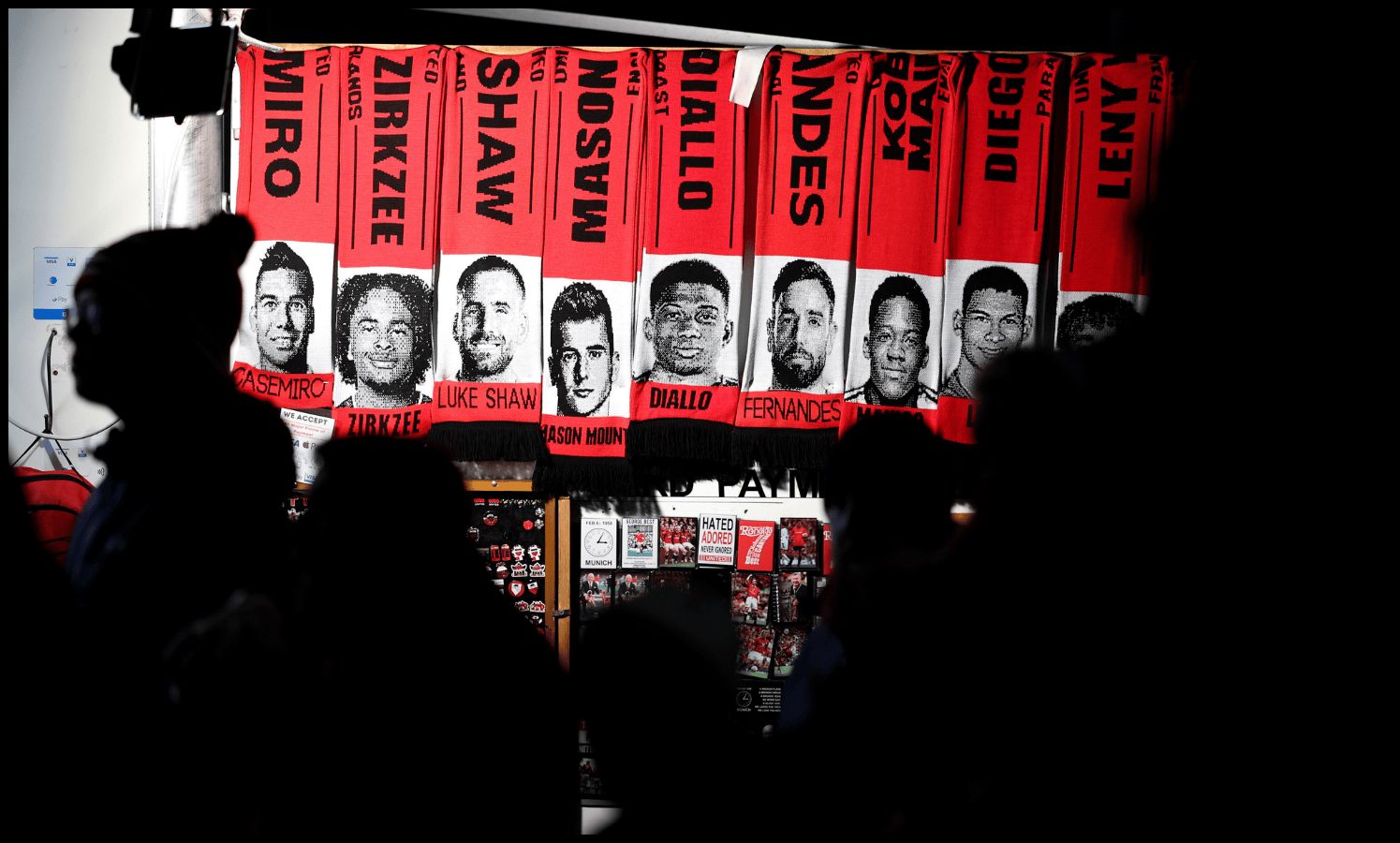 A stand outside Old Trafford sells scarves with the players’ faces on.