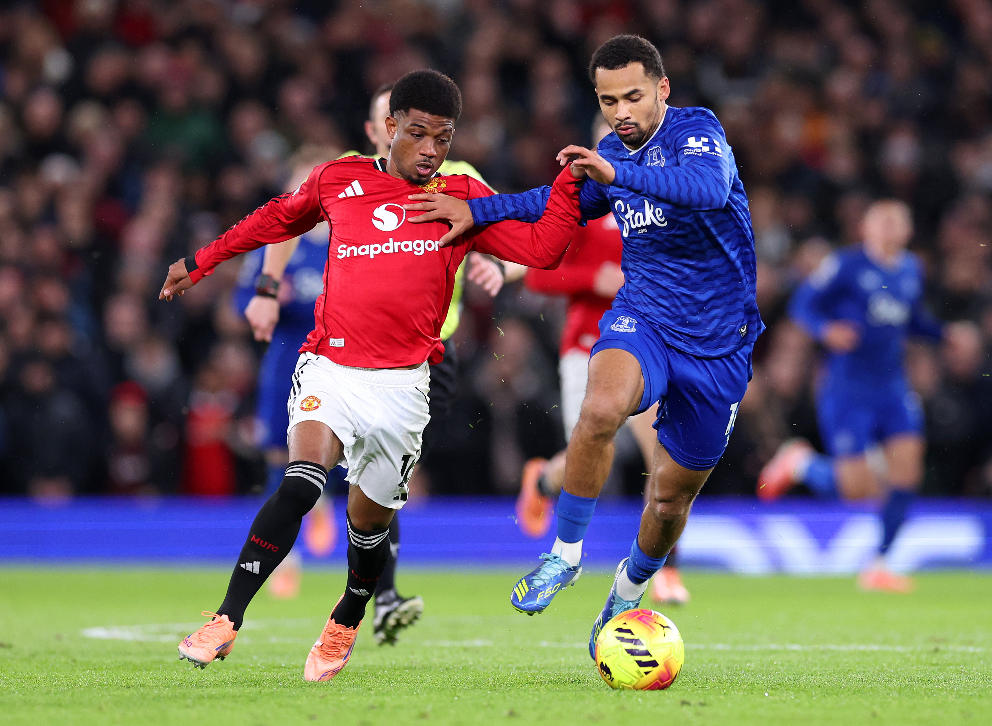 Amad Diallo vies with Iliman Ndiaye.