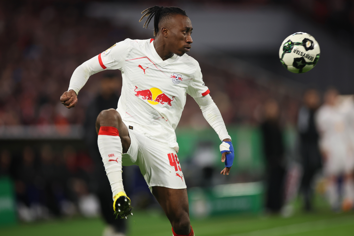 Yan Diomande controls the ball while in action for RB Leipzig.