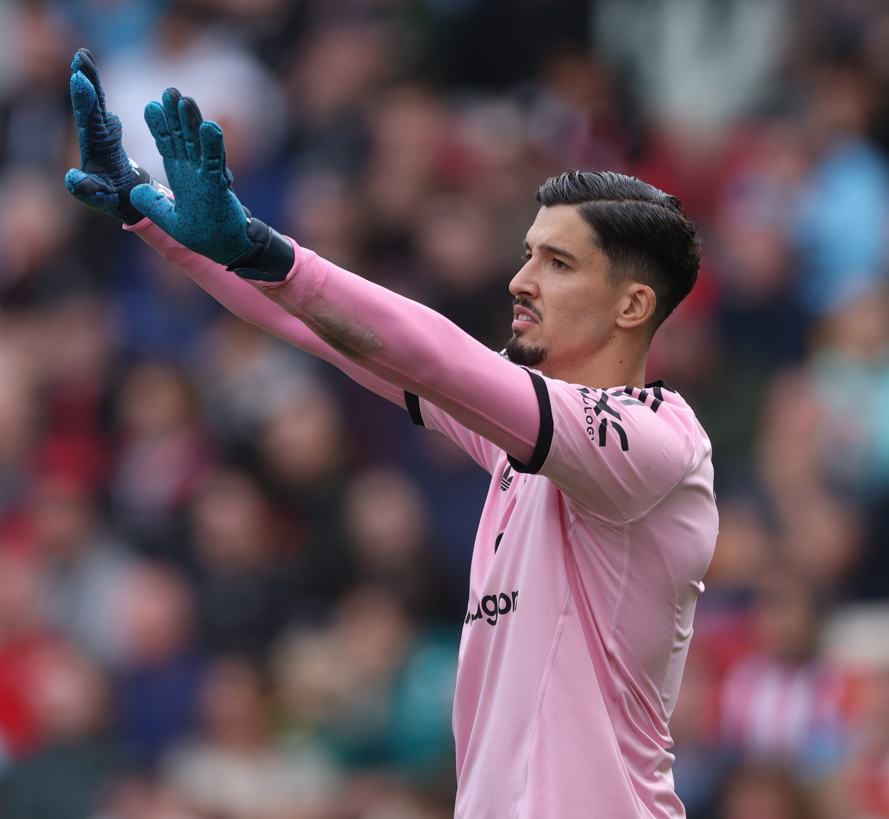 Altay Bayindir gestures while in action for Man United vs Brentford. 