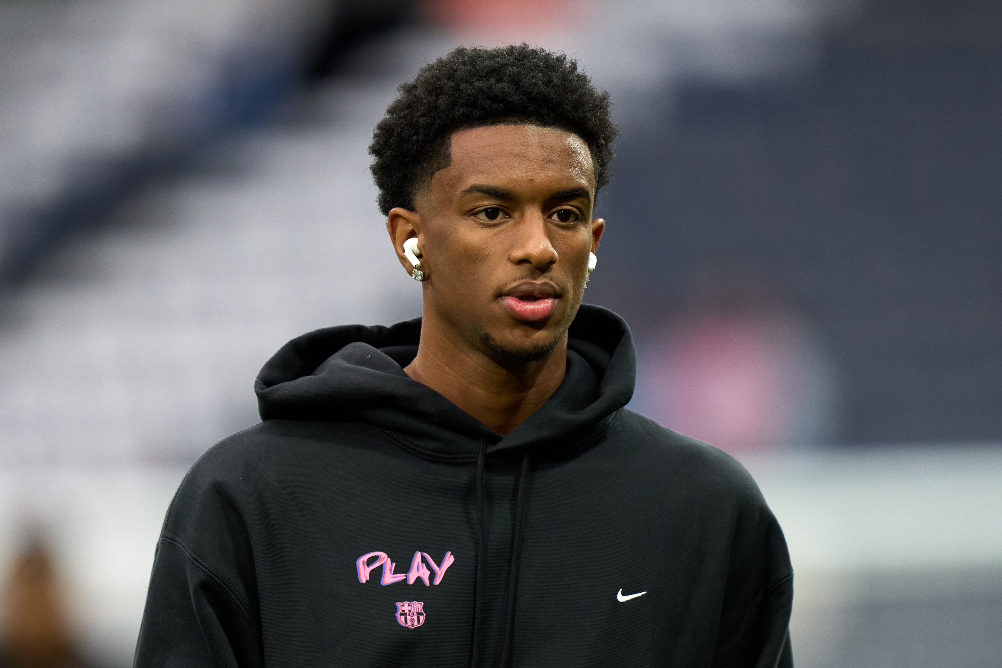 Alejandro Balde inspects the pitch prior to kick-off.