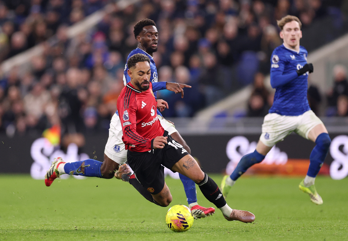 Matheus Cunha falls while being challenged by Everton’s Idrissa Gueye.