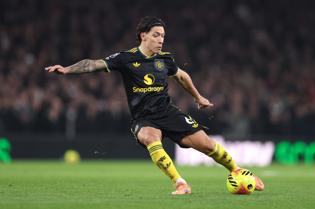 Lisandro Martinez plays the ball while in action for Man United against Arsenal. 
