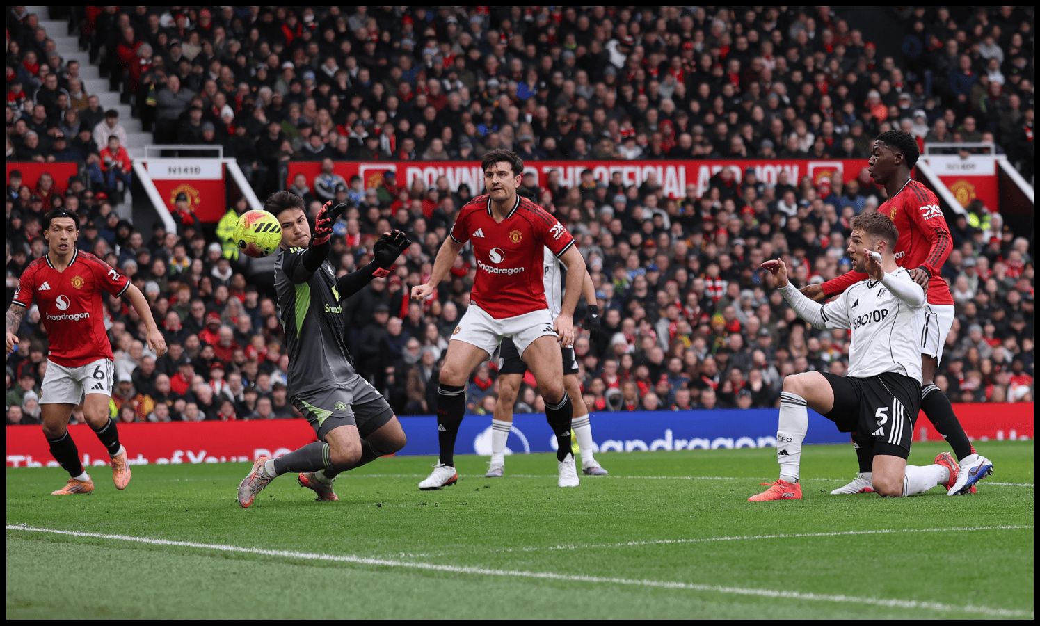 Senne Lammens saves a close-range effort from Fulham’s Joachim Anderson.