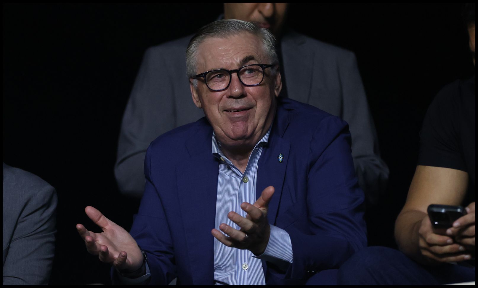 Carlo Ancelotti holds out his hands during a match.