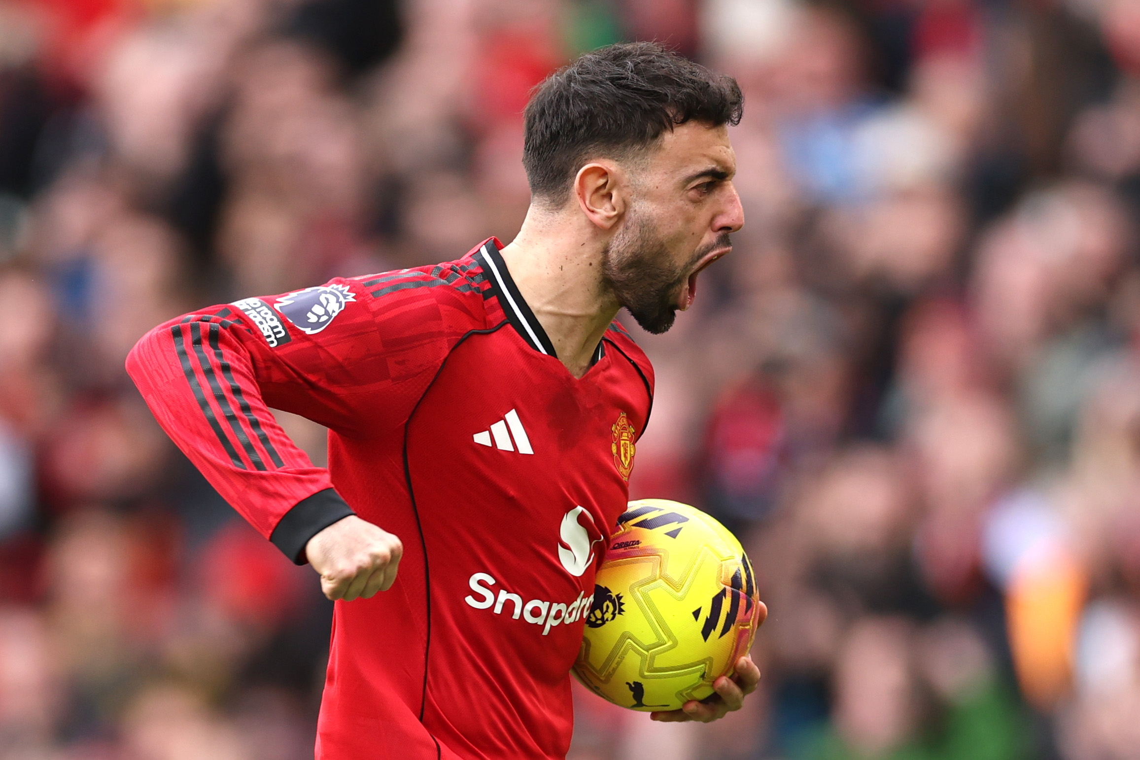 Bruno Fernandes celebrates after scoring a penalty against Crystal Palace.