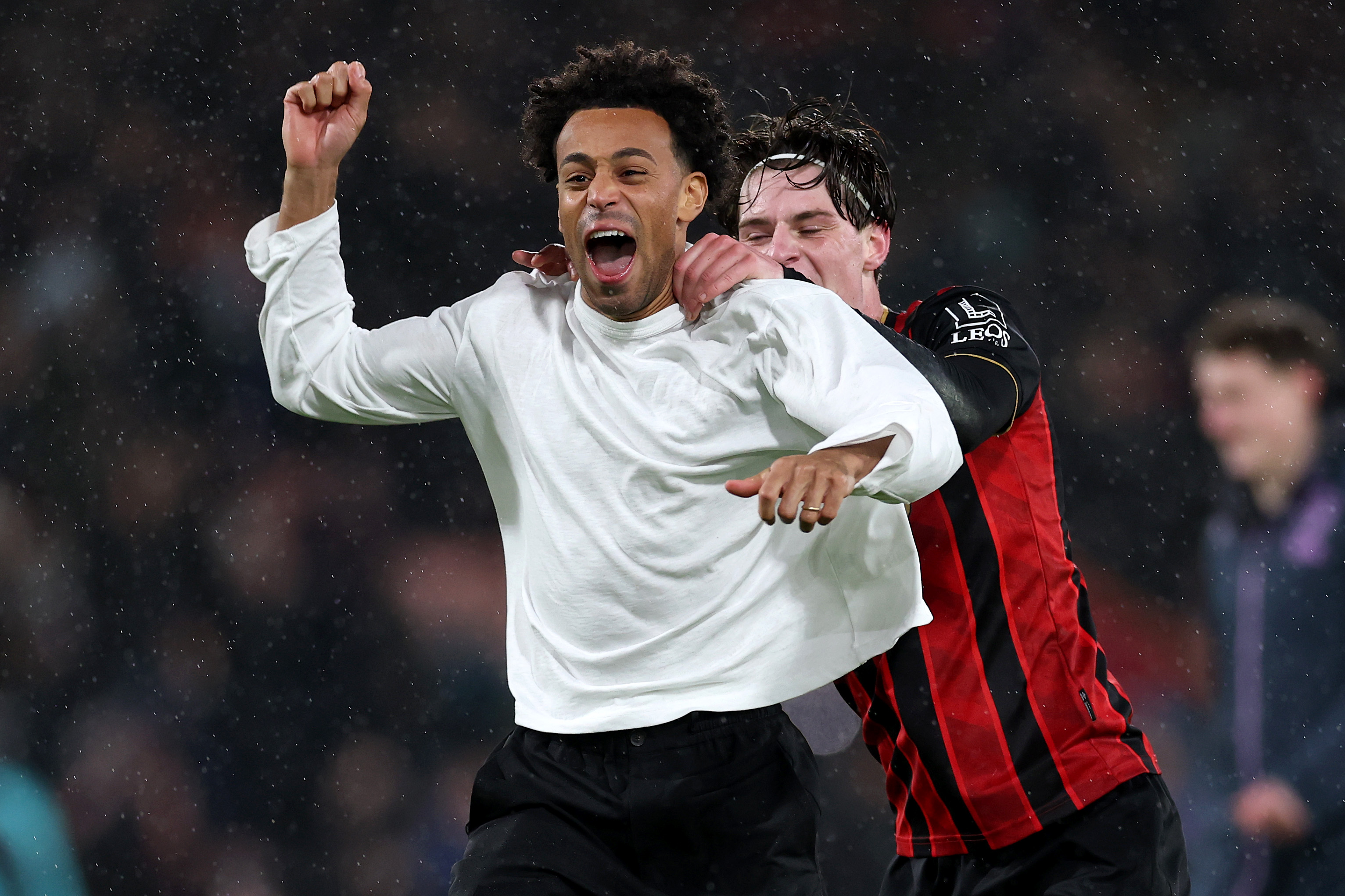 Tyler Adams (injured) celebrates with Alex Scott at full-time after Bounemouth defeat Liverpool.
