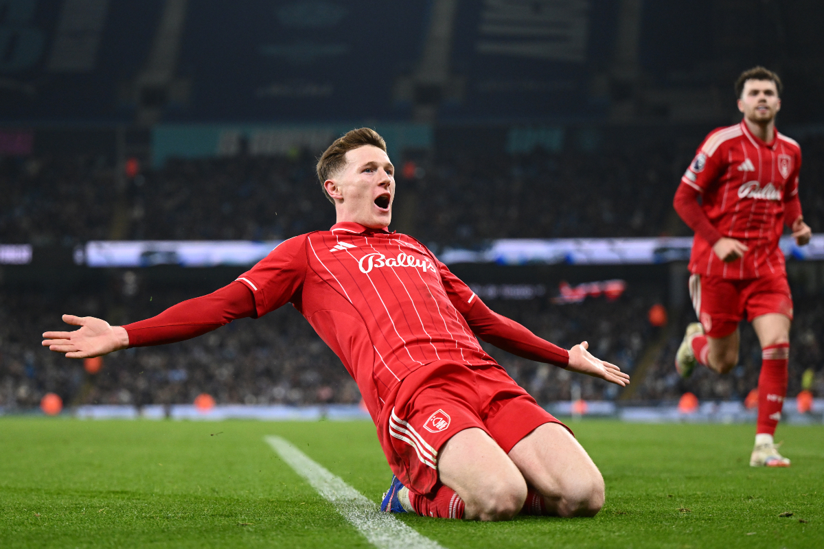 Elliot Anderson knee-slides in celebration after equalising against Man City. 