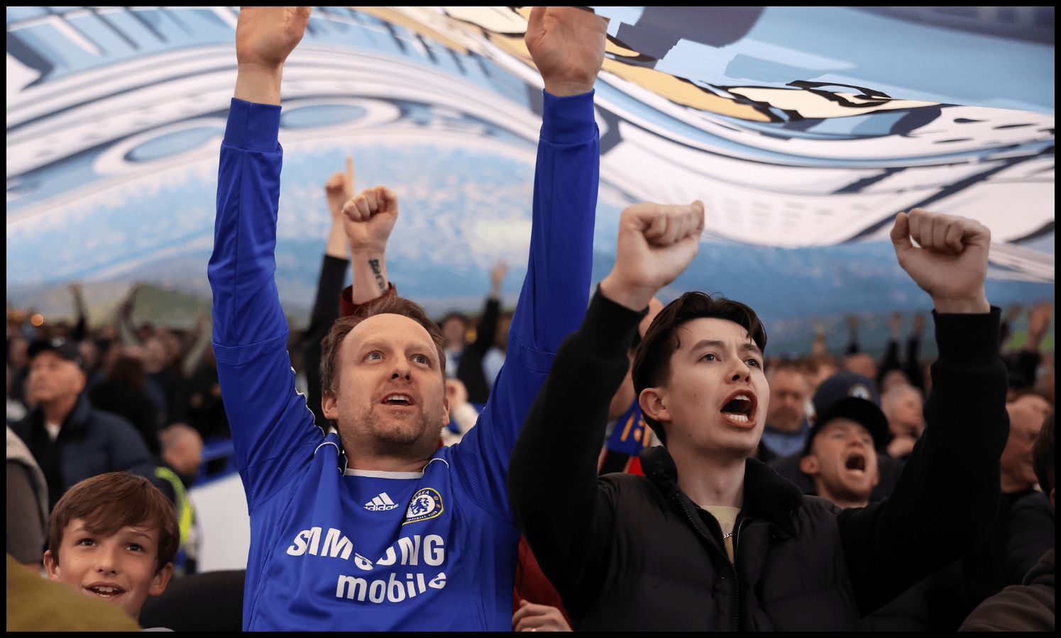 LONDON, ENGLAND - APRIL 03: Fans of Chelsea show support for their team whilst underneath a TIFO prior to the Premier League match between Chelsea FC and Tottenham Hotspur FC at Stamford Bridge on April 03, 2025 in London, England.