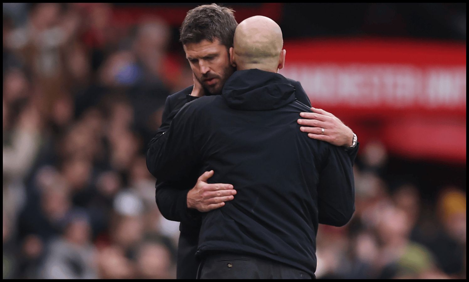 MANCHESTER, ENGLAND - JANUARY 17: Michael Carrick, Interim Head Coach of Manchester United, embraces Pep Guardiola, Manager of Manchester City, after the Premier League match between Manchester United and Manchester City at Old Trafford on January 17, 2026 in Manchester, England.