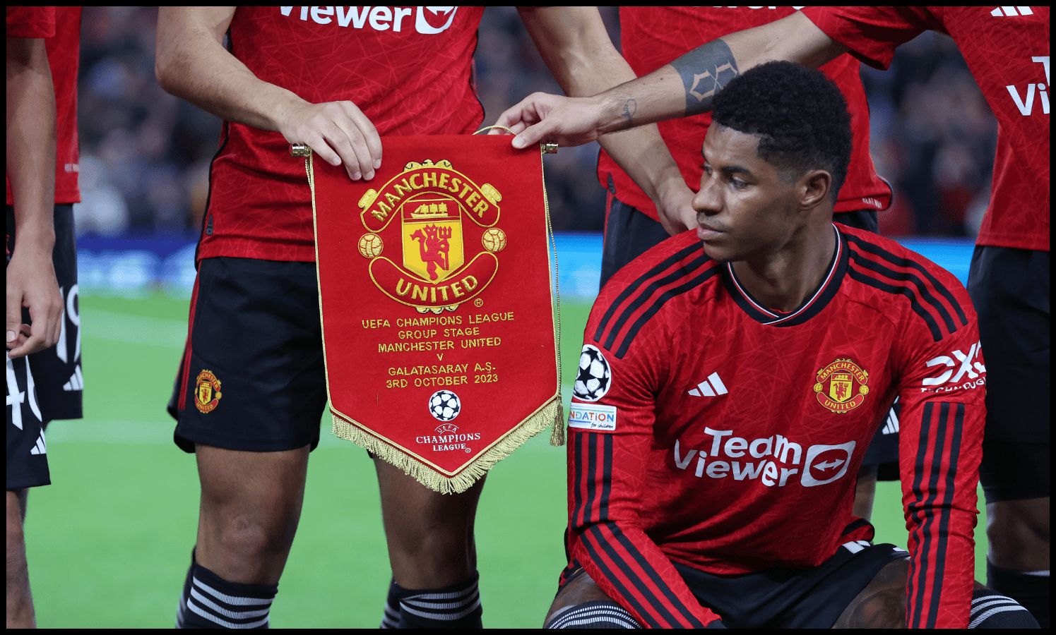 MANCHESTER, ENGLAND - OCTOBER 03: The match pennant of Manchester United is seen prior to the UEFA Champions League match between Manchester United and Galatasaray A.S at Old Trafford on October 03, 2023 in Manchester, England