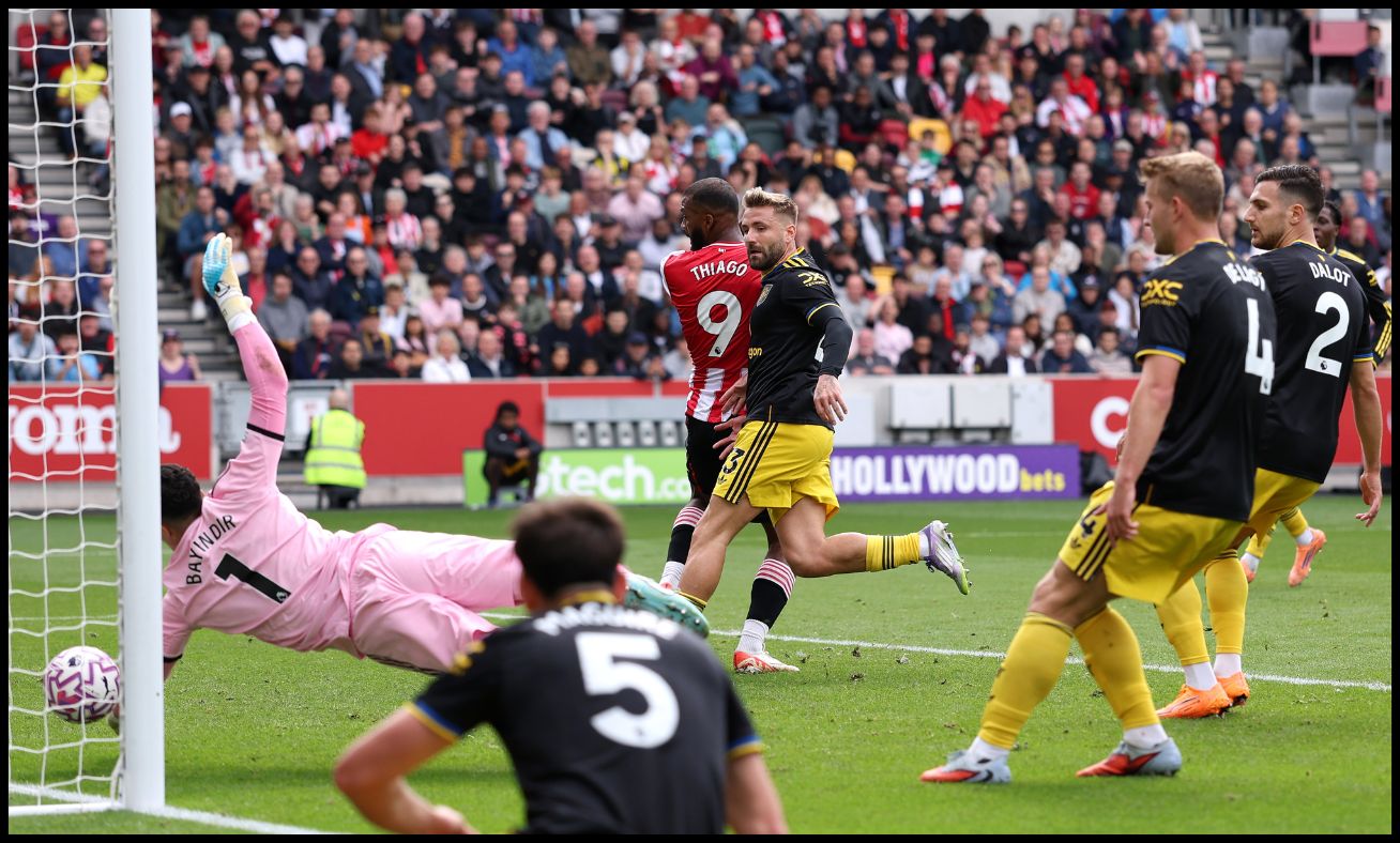 Altay Bayindir pulling off a save against Brentford